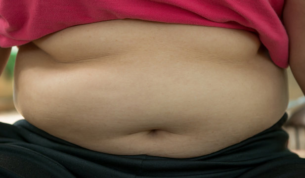 The fat woman pick the paunch with soft light.