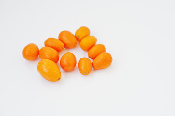 Fototapeta na wymiar Exotic fruits kumquat (Citrus japonica) isolated on white background. Healthy eating dieting food.