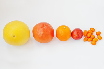 Different type of citrus. Exotic fruits kumquat with orange, blood (sicilian) orange and grapefruit isolated on white background. Healthy eating dieting food.