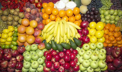 Close up of many colorful fruits on farmers market stand