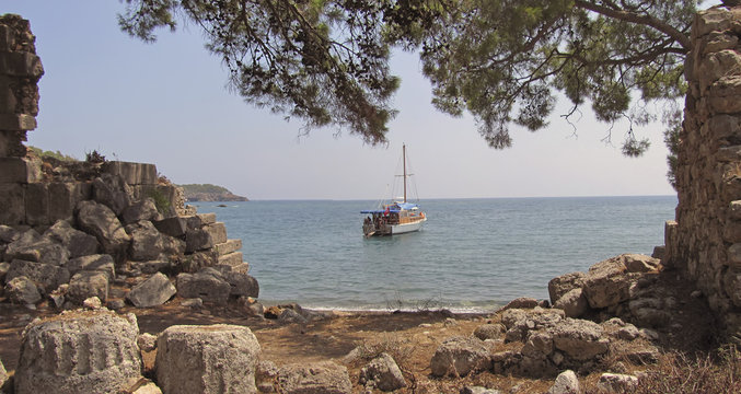 Ship in the sea near the ruins
