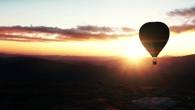 4K Animation of Hot Air Balloon in Mountains at Sunset