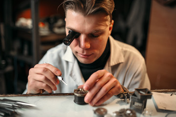Clock maker repair old clockwork gear