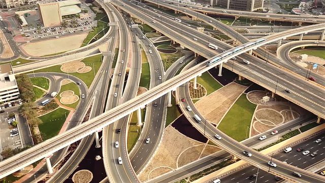 Close up view of a busy highway intersection in Dubai, UAE, at daytime. Travel and transportation concept.  