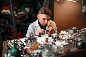 Obraz na płótnie Canvas Clock maker repair vintage clocks gear