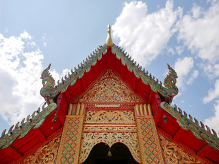 Naklejka premium Buddhist temple roof at Wat Phra That Doi Kham (Temple of the Golden Mountain) in Chiang Mai, Thailand