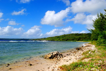 Lau Lau Beach, Saipan. Lau Lau Beach is known for its interesting rock outcroppings and is popular for divers.