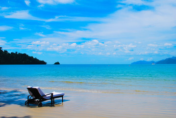 View from a beach in a tropical island, Langkawi in Malaysia : blue sky, blue water and sand.