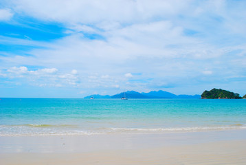 View from a beach in a tropical island, Langkawi in Malaysia : blue sky, blue water and sand.