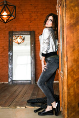 Girl posing in a silver jacket. The Studio photos. r