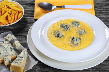 polenta with gorgonzola in white plate