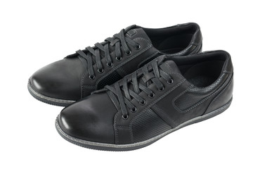 A side view of a pair of black men's shoes for sports.