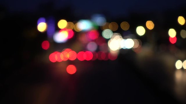 4K Bokeh of car lights. On the street at night Colorful Circles Video Background Loop Glassy circular shapes perform a colorful dance. motion background that is just perfectly suited for DVDs, events
