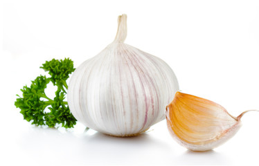 Garlic and parsley leaves isolated on white