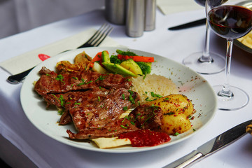 Grilled meat and baked vegetables in a Turkish restaurant
