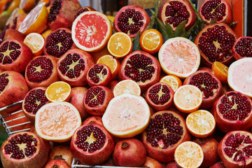 Heap of ripe pomegranates and citrus fruits on a farmer market in Istanbul, Turkey