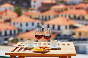 Madeira wine, coffee and sweets with view to Funchal, Madeira, Portugal