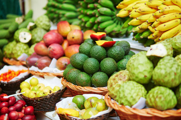Fresh and ripe exotic fruits on traditional farmer market on Madeira