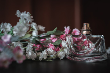 Obraz na płótnie Canvas Female perfume with flowers