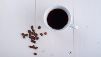 Coffee in a white cup on a white background