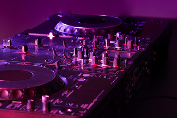 Obraz na płótnie Canvas Dj mixer in nightclub, closeup