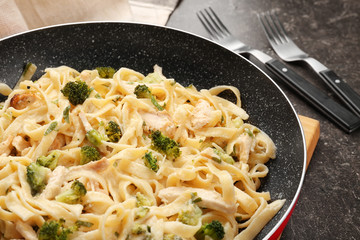 Frying pan with delicious chicken Alfredo, closeup