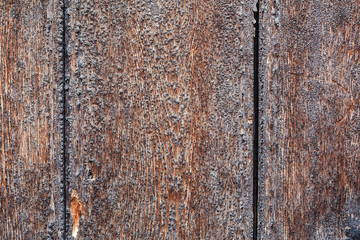 close up of weathered and textured boards on an old wooden castle door
