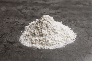 Heap of flour on table