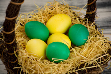 Fototapeta na wymiar Yellow and green easter eggs