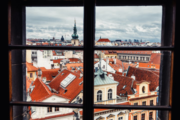 Beautiful View On Prague red roofs from the window of the hotel or restaurant