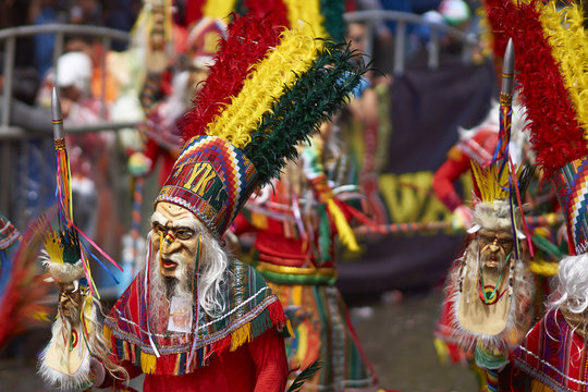 Tobas dancers in colourful costumes performing at the annual Oruro Carnival. The event is designated by UNESCO as being Intangible Cultural Heritage of Humanity.