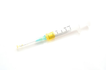 Syringe with yellow liquid isolated on white background. Good photo for your store internet.