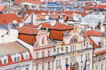 Aerial cityscape view of houses and orange roofs typical of Prague
