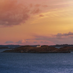 Naklejka na ściany i meble A lonely house on a small island in Norway
