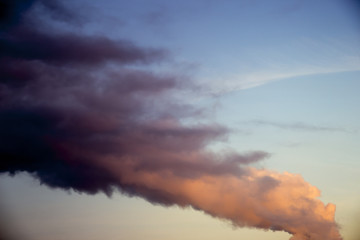strip of black smoke on blue sky
