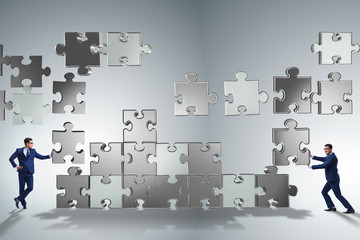 Business concept of teamwork with puzzle pieces