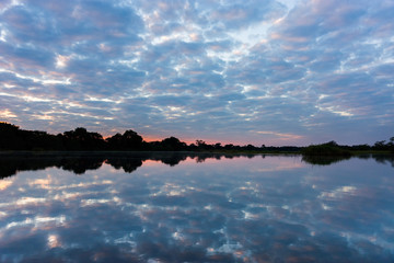 Zambezi river border between Caprivi region, Namibia, and Zambia, at sunset.
