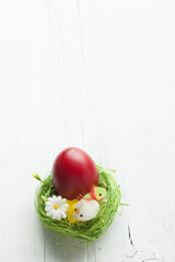 Easter eggs and white wooden country table, background and texture, copyspace