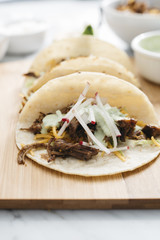 Carnitas Tacos with Cilantro Cream Sauce