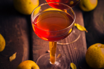 cup tincture wooden table fruits quince