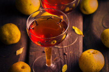 cup tincture wooden table fruits quince