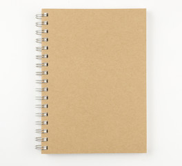 Brown notebook on a white background. top view,selective focus