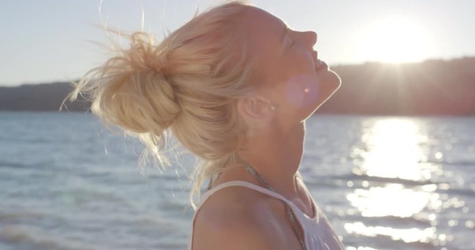 Close Up Portrait Of Beautiful Young Woman Running Hand Through Hair Blowing In Wind On Tropical Beach Slow Motion