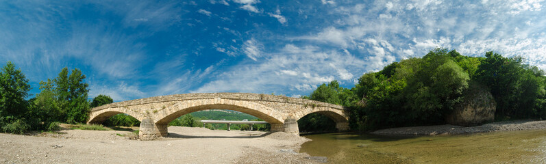 Beautiful bridge above the White river in caucasian mountains in Adygea, Russia