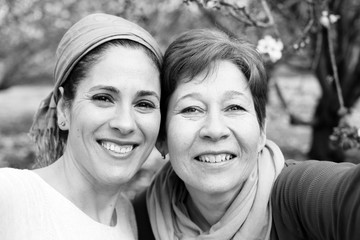 Outdoor portrait of two 45 years old woman