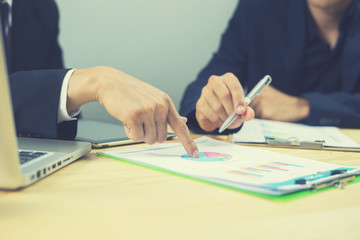 Businessman team meeting present.professional investor working with new startup project. Finance managers task.Digital tablet laptop computer design, marketing business plan ,vintage color