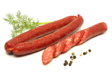 sliced red salami isolated on white background