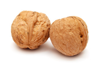 Dry walnuts in shell isolated on white background. Flat lay, top view