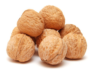 Dry walnuts in shell isolated on white background. Flat lay, top view