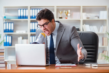 Fototapeta premium Angry aggressive businessman in the office